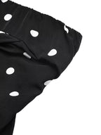 Polka dot strapless wide-leg jumpsuit by Plush Fashion Hub, showing flowy fabric and stylish design for a comfortable look