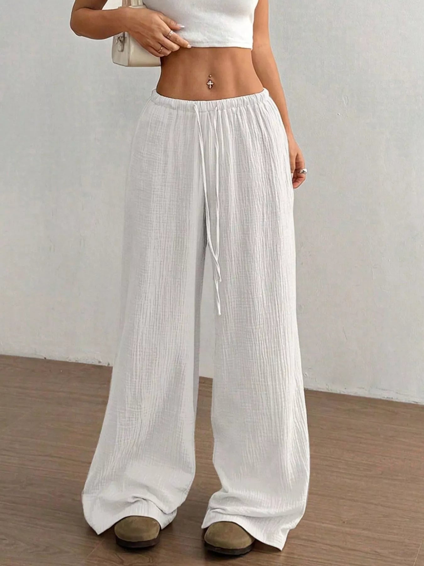 Plush Fashion Hub wide-leg drawstring pants in soft fabric, featuring a relaxed fit and casual style, shown in a natural pose.