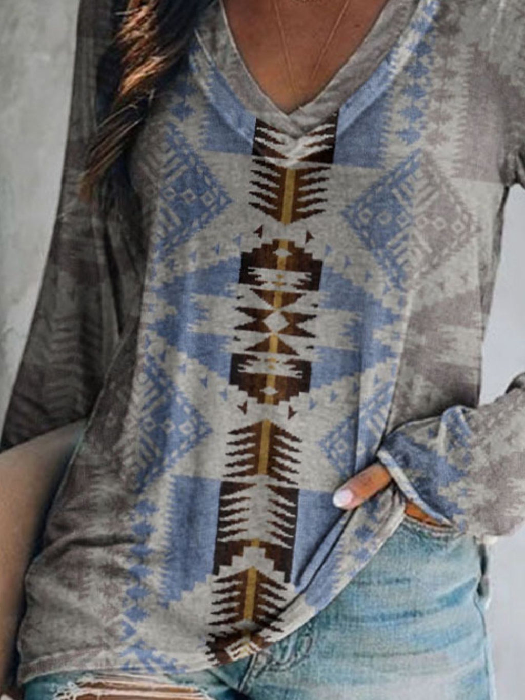 Plus size Trendsi geometric print V-neck long sleeve T-shirt with casual style and comfortable fit, featuring modern geometric pattern.