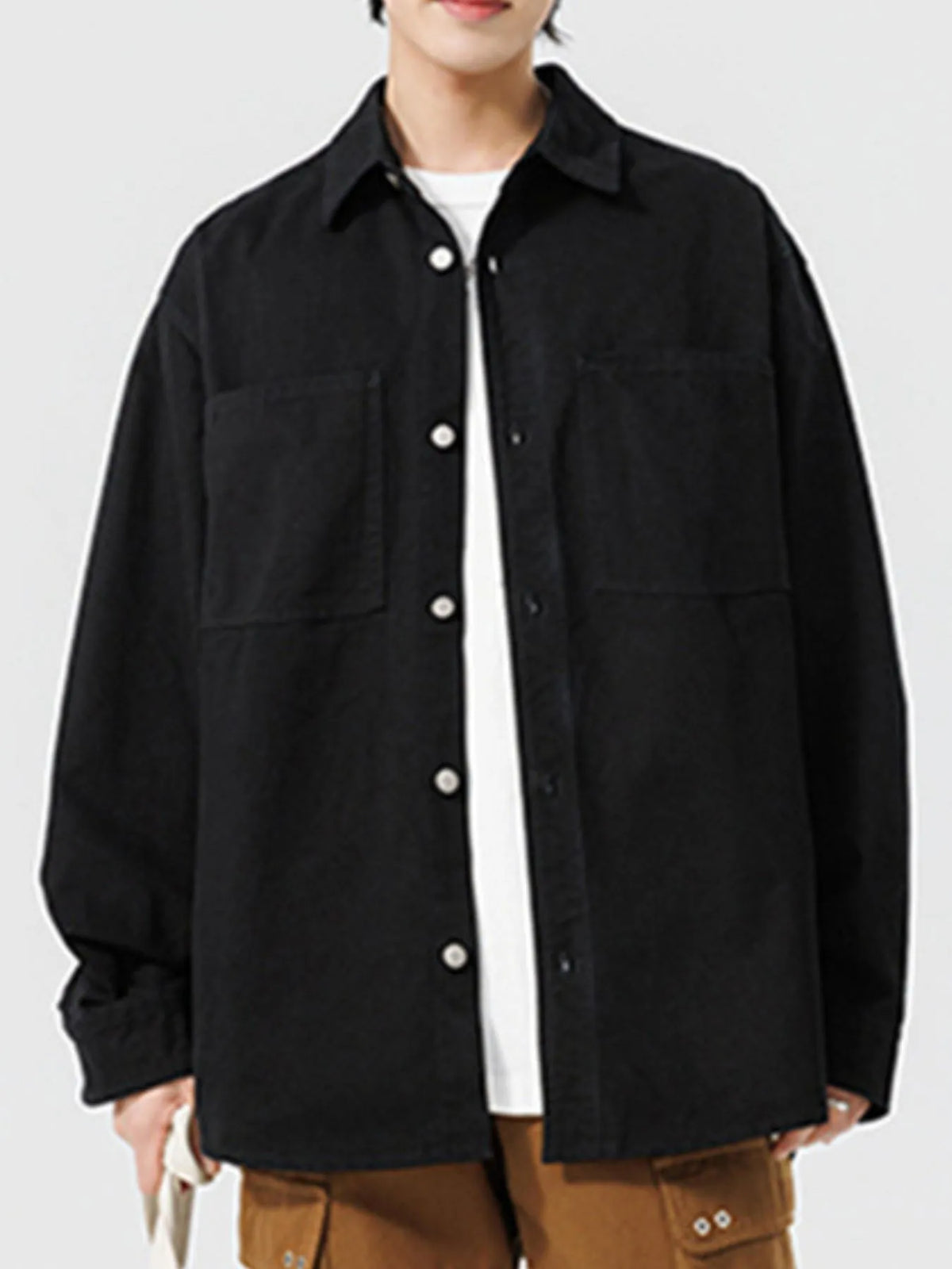 Men's long sleeve button-up shirt by Trendsi, featuring a classic collar, front buttons, and a tailored fit.