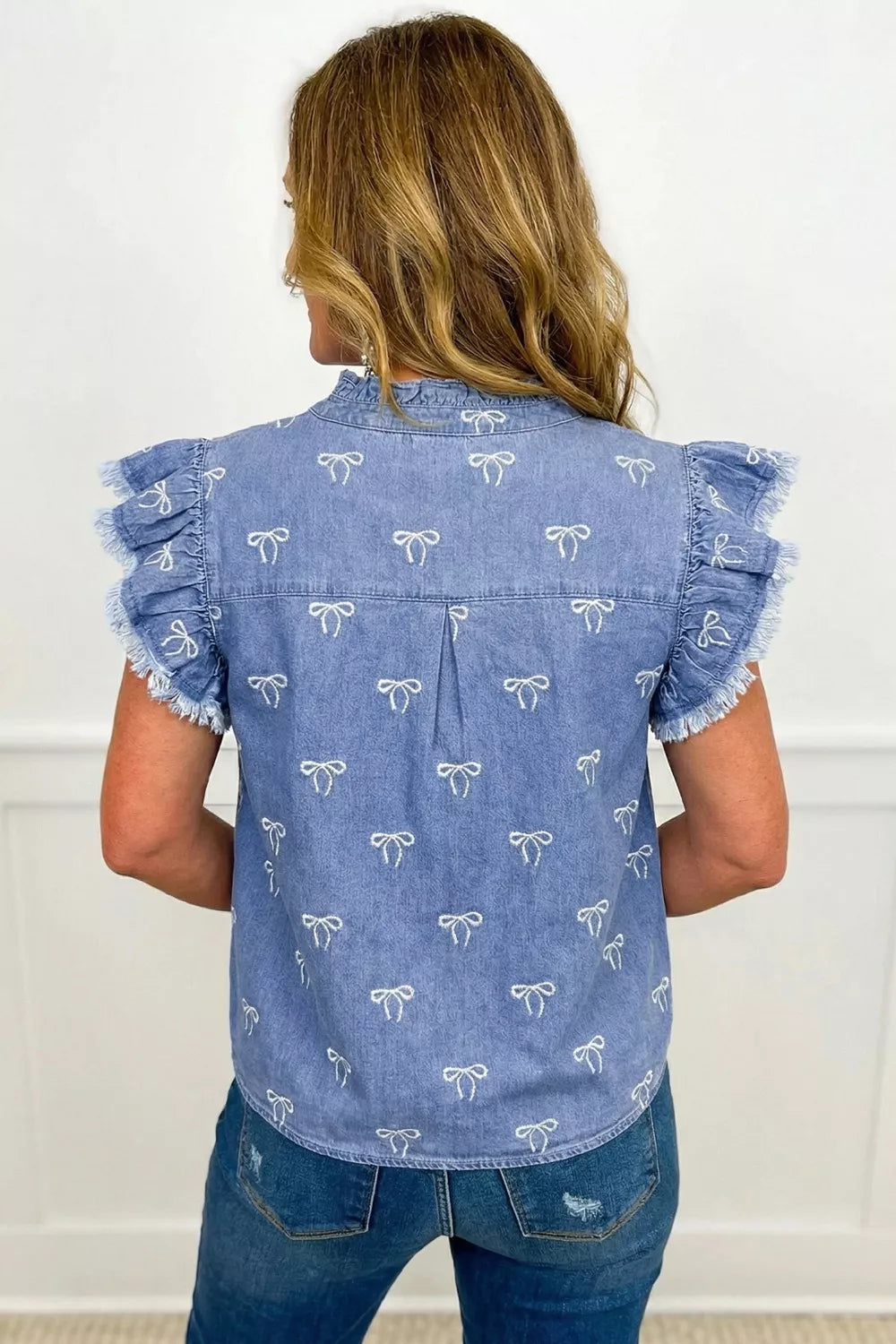 Blue denim top with frilled collar and flutter sleeves from Plush Fashion Hub, featuring a stylish, casual shirt design.