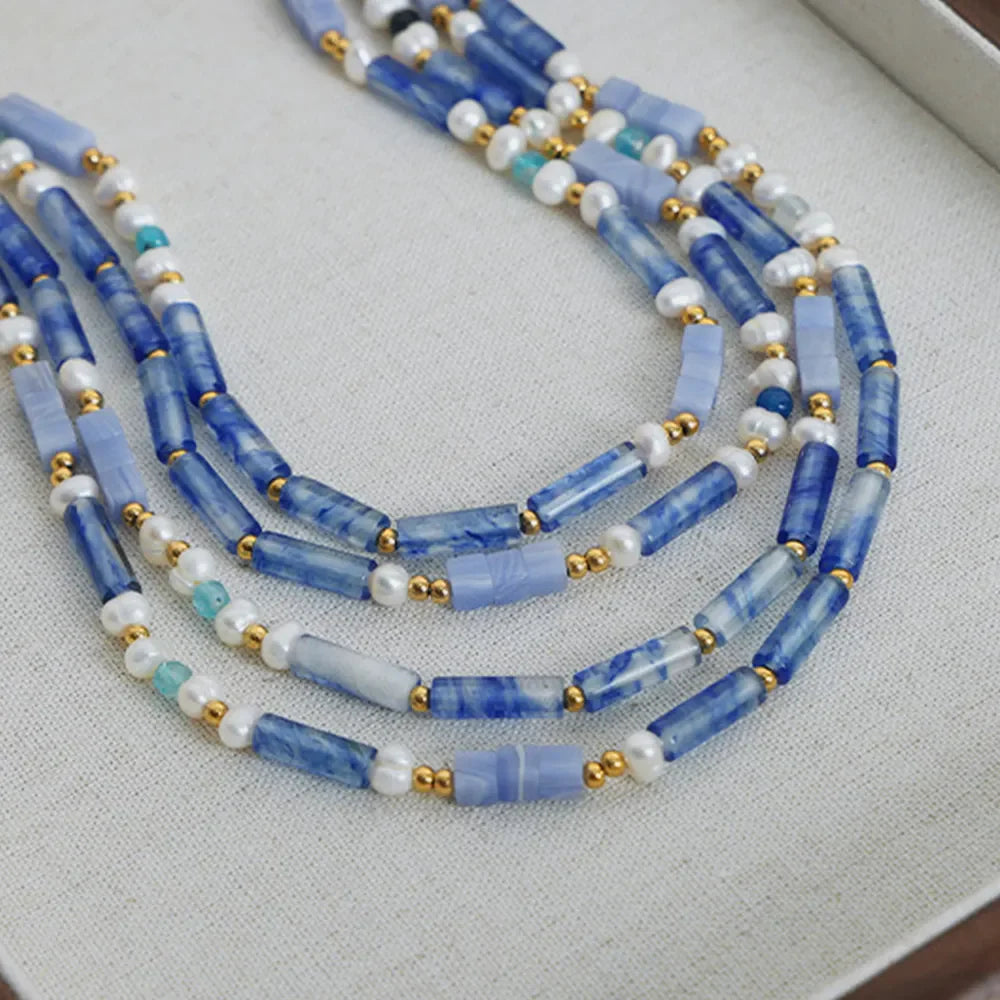 Freshwater pearl and titanium steel geometric bead necklace featuring modern design and elegant craftsmanship.