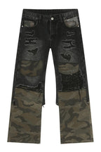 Distressed camouflage patchwork jeans from Trendsi featuring ripped details and a rugged, stylish design.