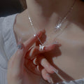 925 Sterling Silver Zircon Butterfly Necklace with delicate chain and sparkling zircon stones, showcasing a butterfly pendant.