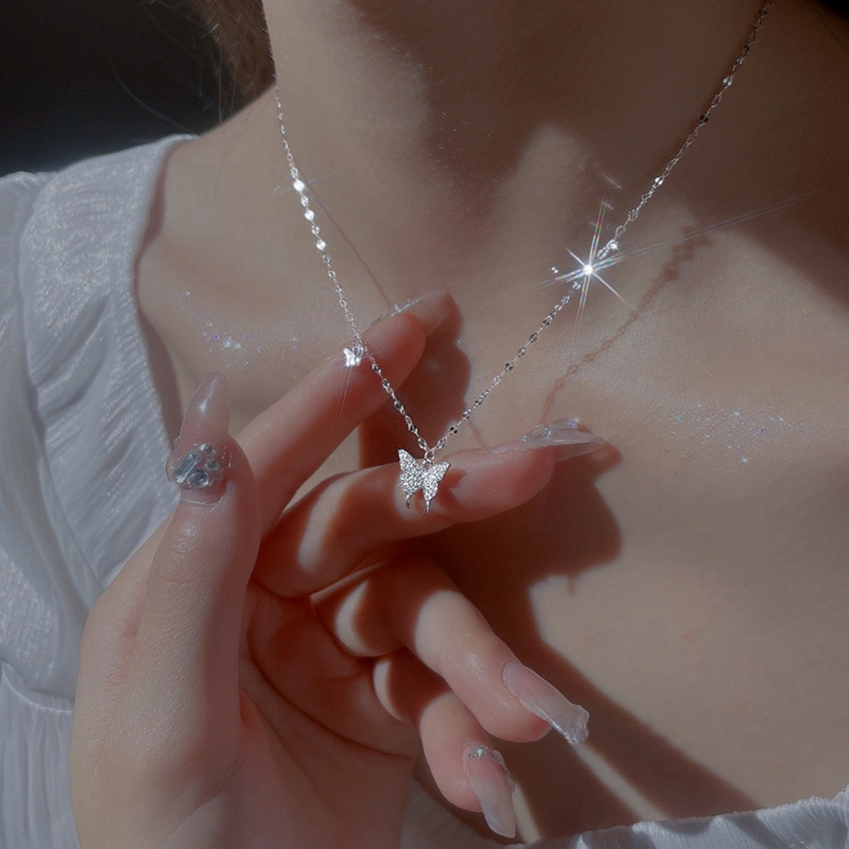 925 Sterling Silver Zircon Butterfly Necklace with delicate pendant, featuring sparkling zircon stones on a fine chain.