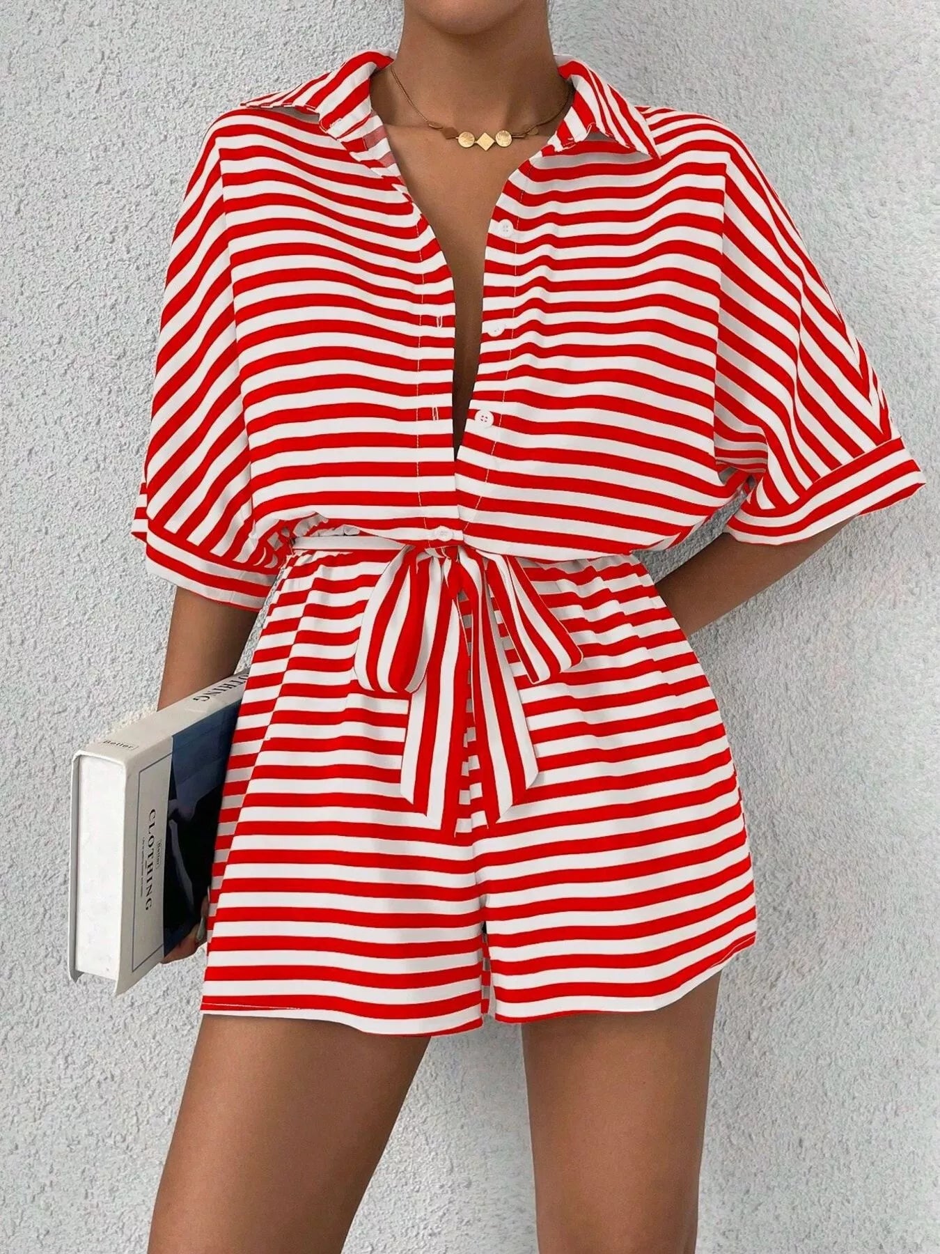 Striped button-front half sleeve romper shirt from Plush Fashion Hub, casual and stylish with a comfortable fit and modern design.