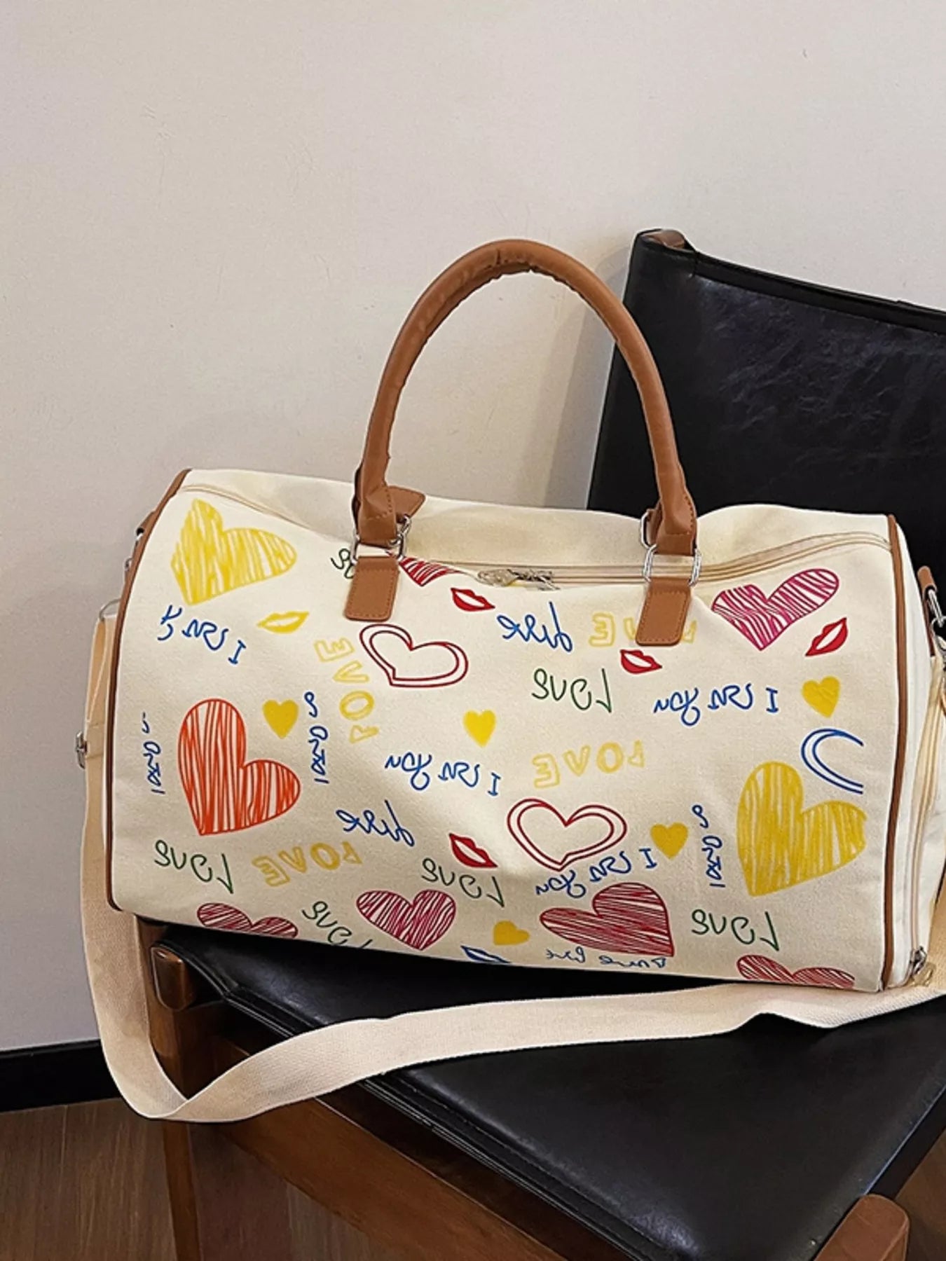 Printed duffel bag with adjustable strap by Shopimist, showing its spacious design and stylish printed pattern.