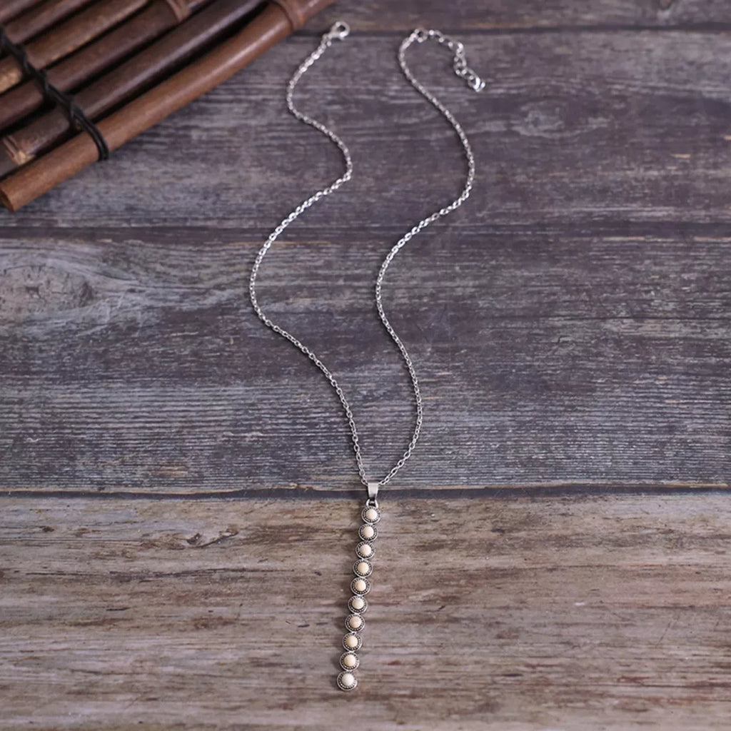 Vintage style beaded bar necklace by Shopimist featuring colorful beads on a sleek metal chain.