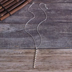 Vintage style beaded bar necklace by Shopimist featuring colorful beads on a sleek metal chain.