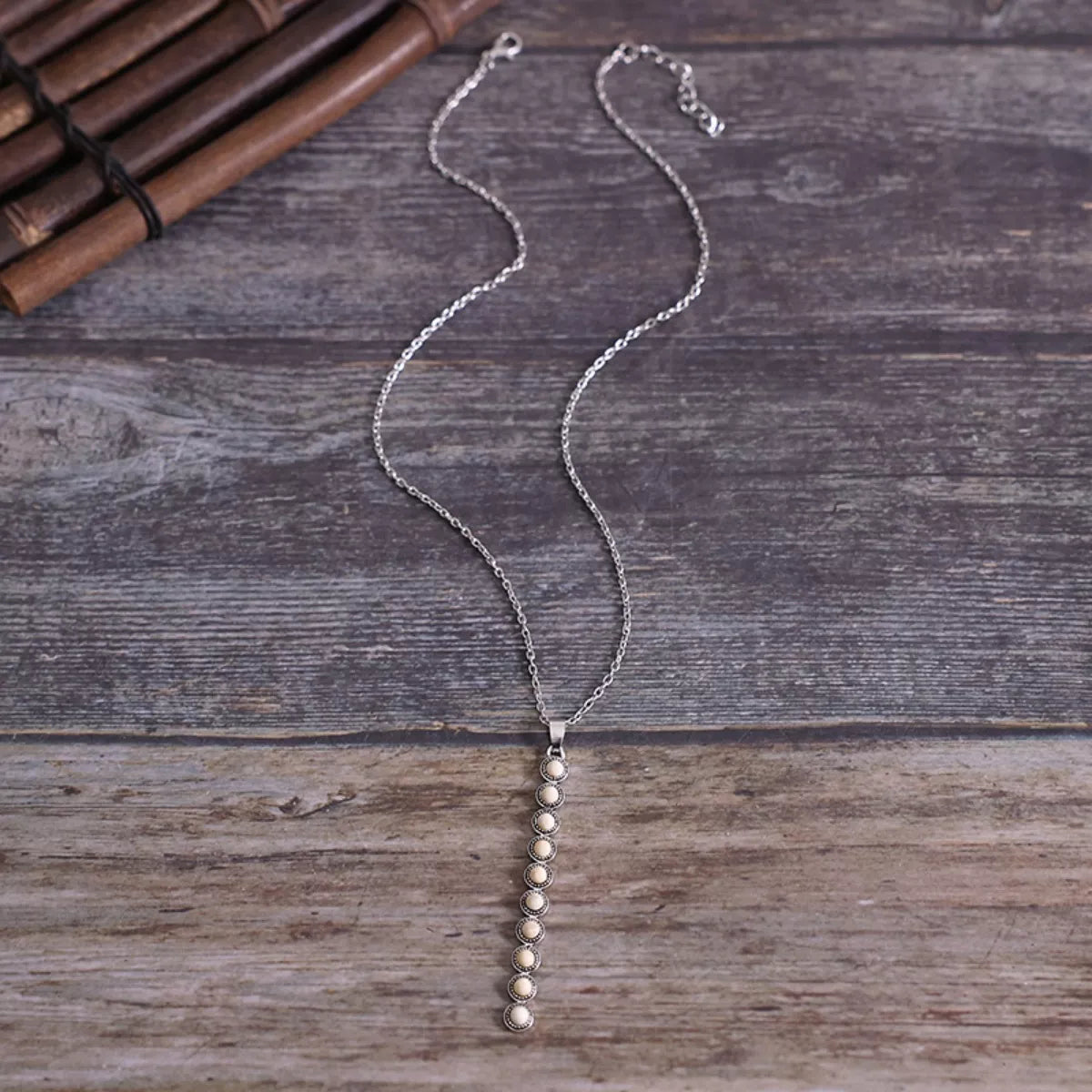 Vintage style beaded bar necklace by Shopimist featuring colorful beads on a sleek metal chain.