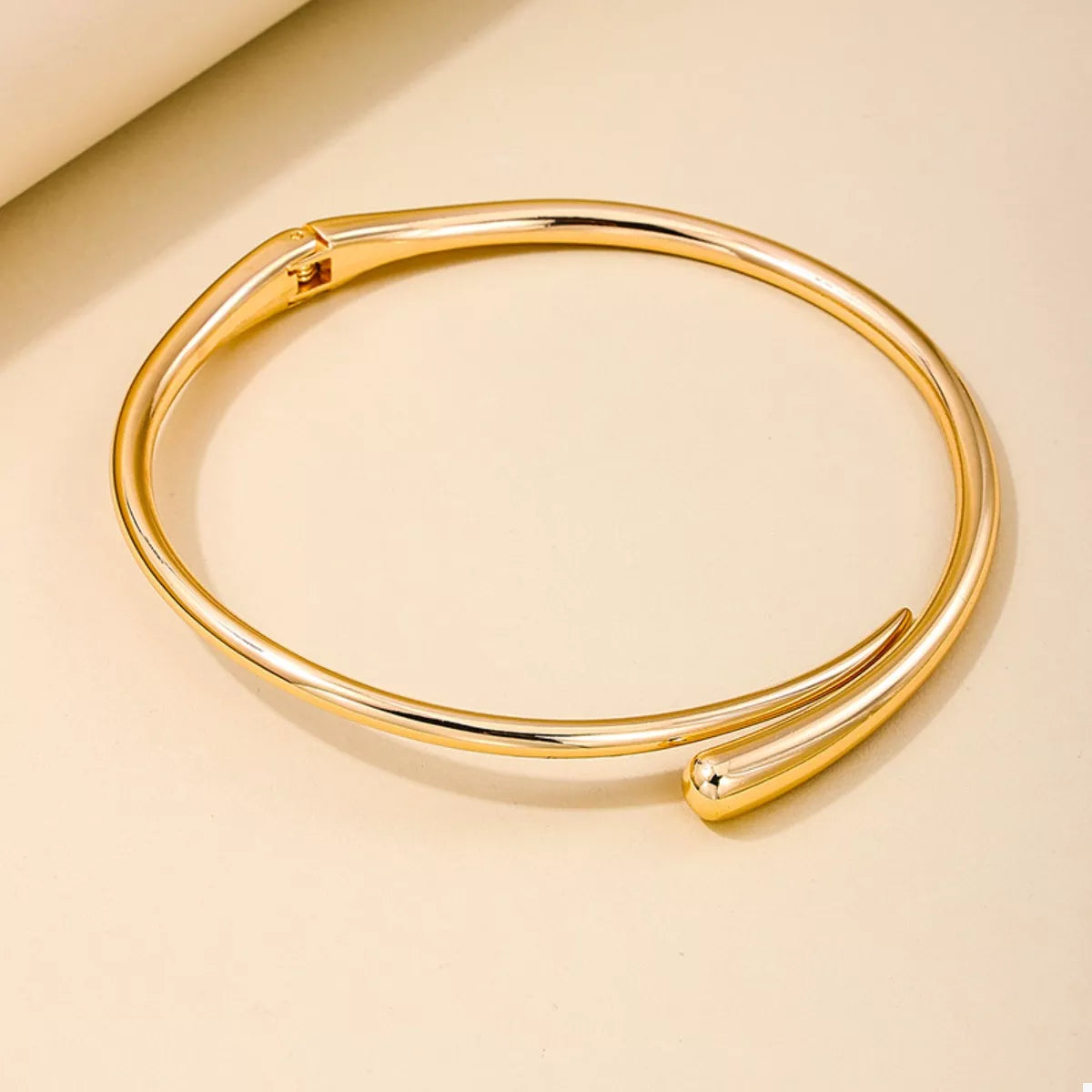 18K gold-plated alloy adjustable necklace with delicate chain and subtle pendant, showcasing elegant jewelry design.
