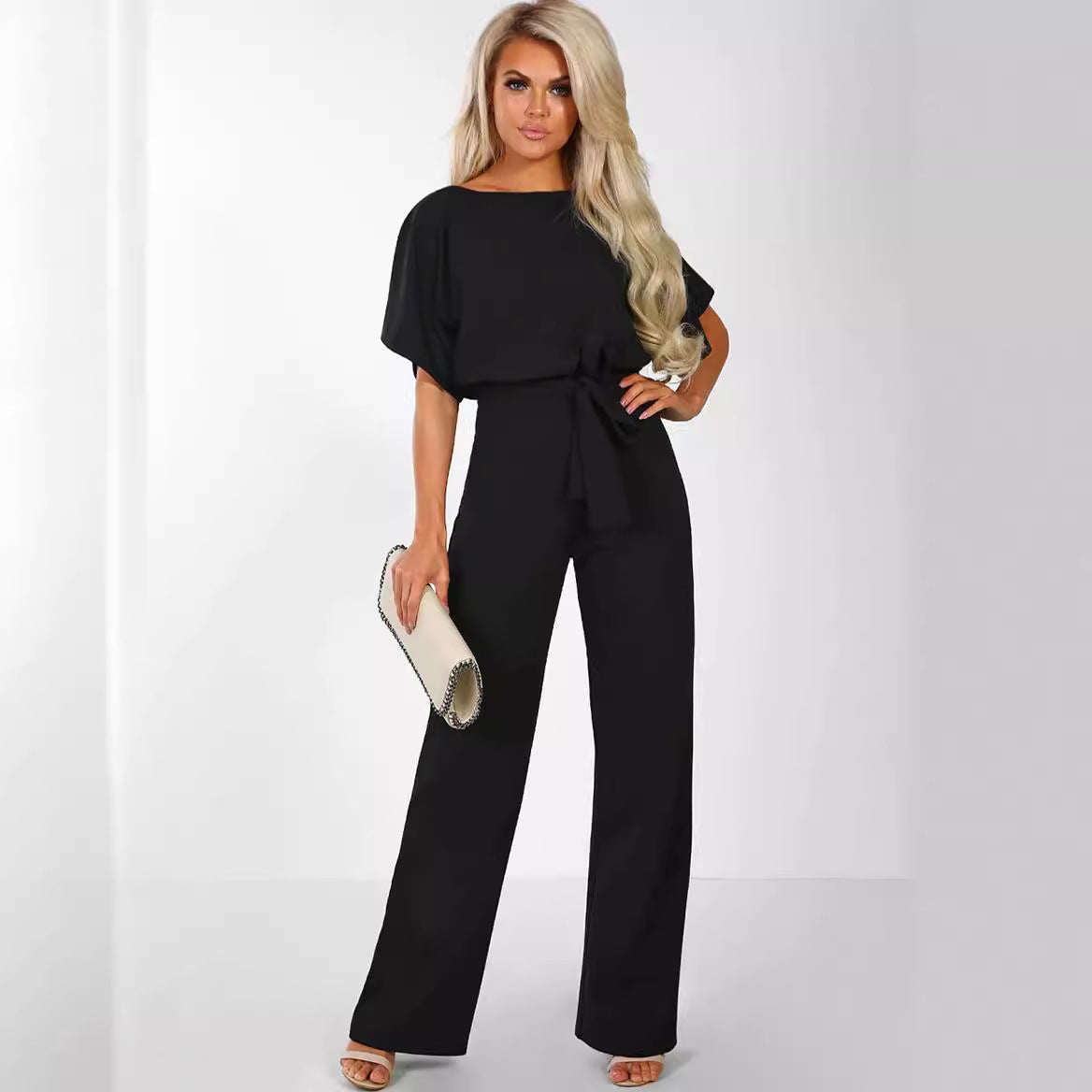Plush Fashion Hub women's short sleeve body suit with straight-leg design, made of stretchy fabric, featuring shoulder straps and fitted silhouette.