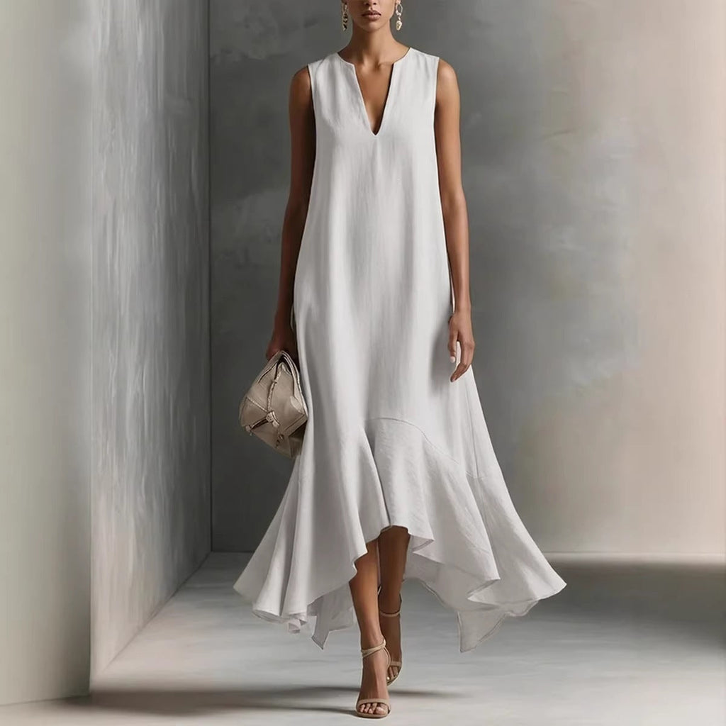 Women's deep V-neck sleeveless asymmetrical patchwork maxi dress by FitiqueFit, featuring flowing fabric and stylish design.
