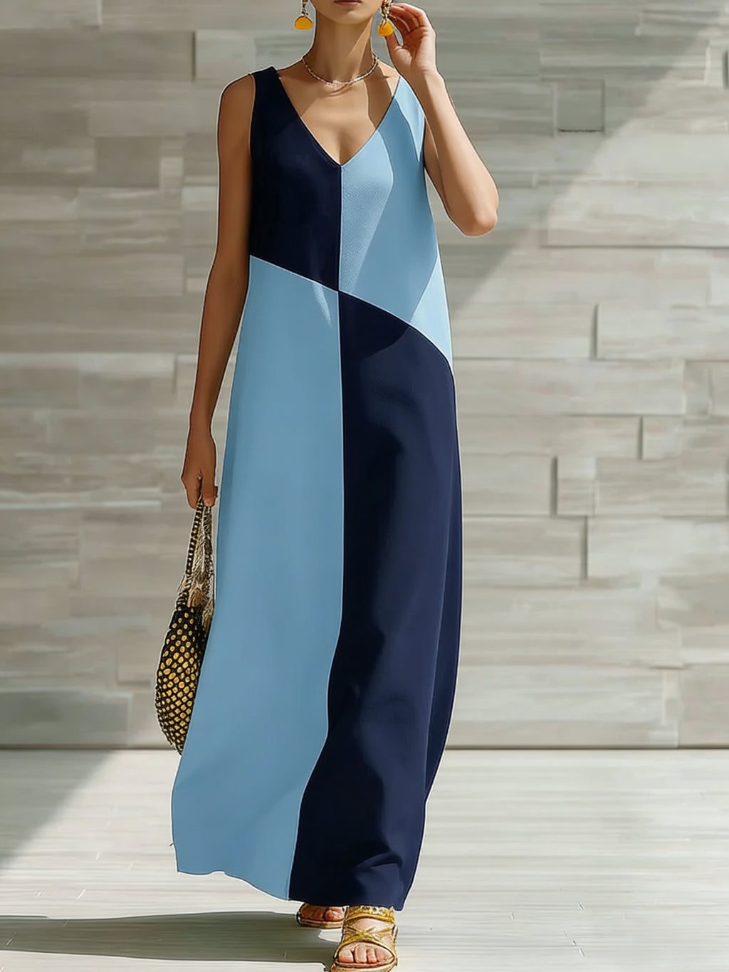 Women's chic color block sleeveless maxi dress by Trendsi, lightweight summer fashion with vibrant color blocks and flowing fabric.