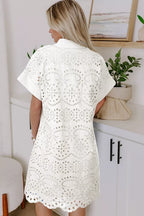 Solid color eyelet embroidered mini dress from Trendsi featuring a T-shirt style, eyelet details, and casual fit.
