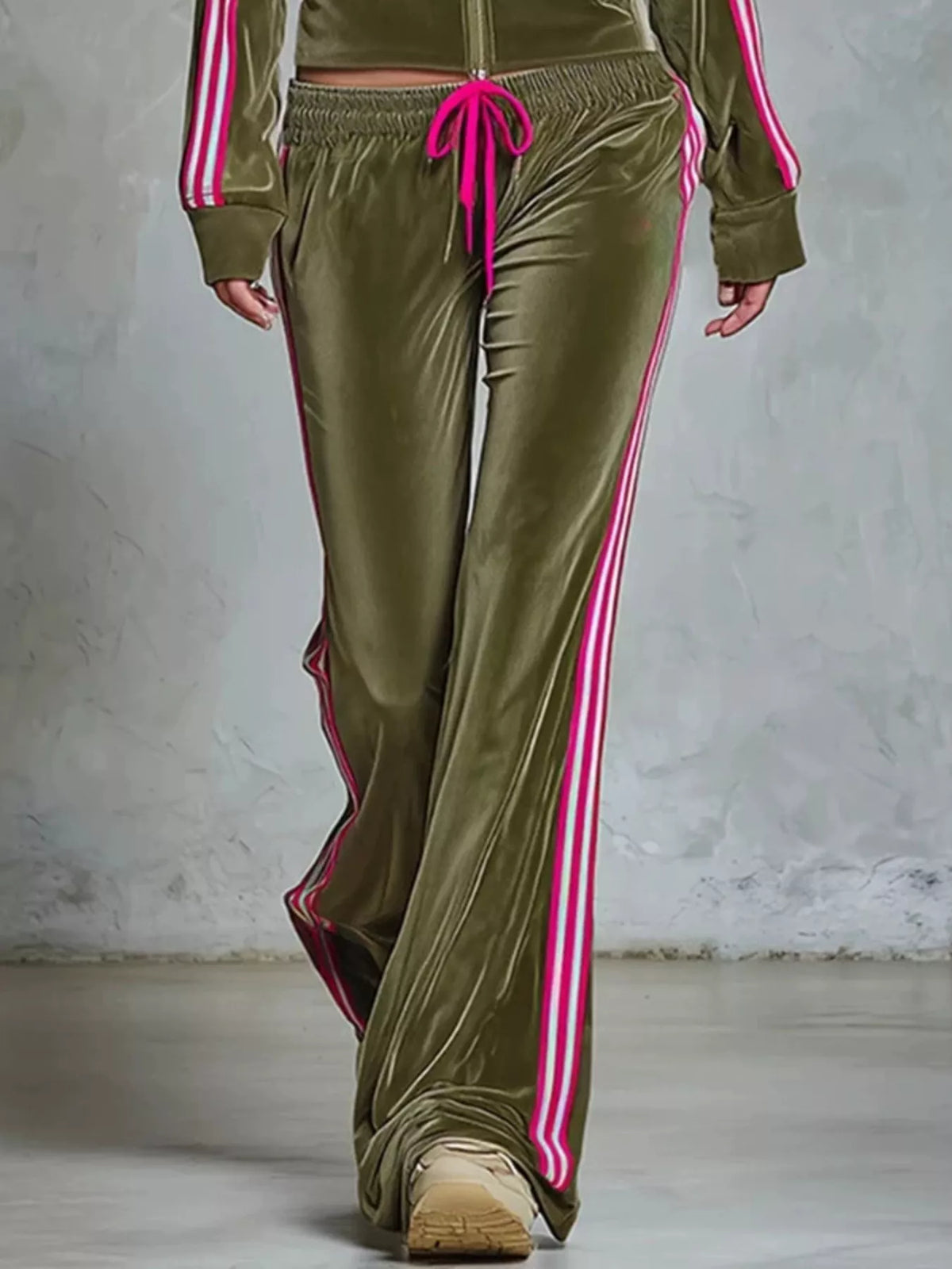 Striped zip-up outerwear and pants matching set by Trendsi, featuring a stylish design and comfortable fit.