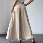 Women's high-waist pleated wide-leg linen pants from FitiqueFit, casual bohemian style, relaxed fit, soft linen fabric.
