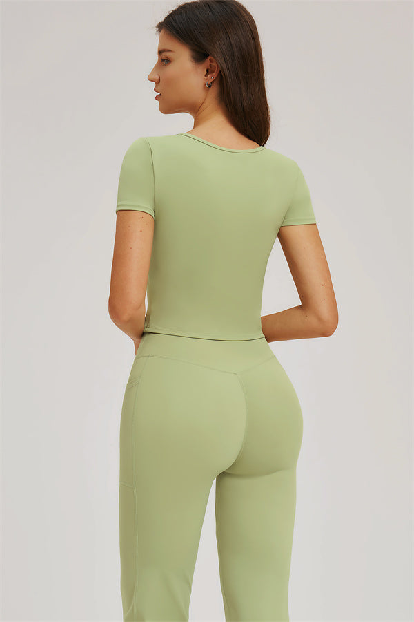 Plush Fashion Hub Sizzle T-Shirt and flared leggings 2-piece set, black and white, casual style, front view on a model.