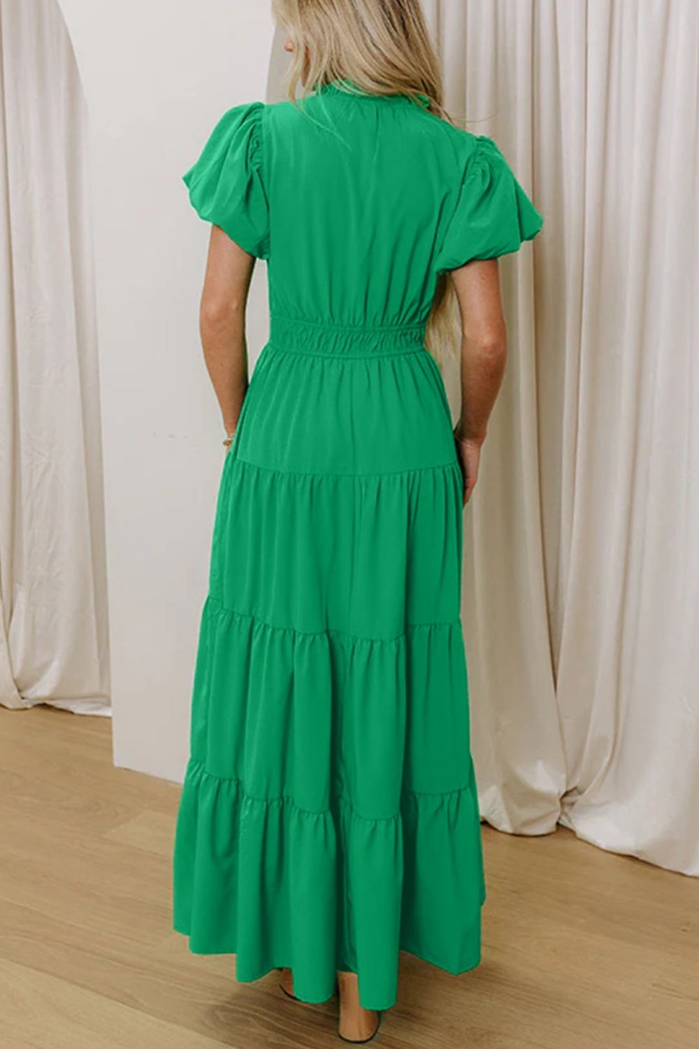 Women's floral ruffled tiered puff sleeve maxi dress by Plush Fashion Hub, featuring elegant long design with ruffle details.