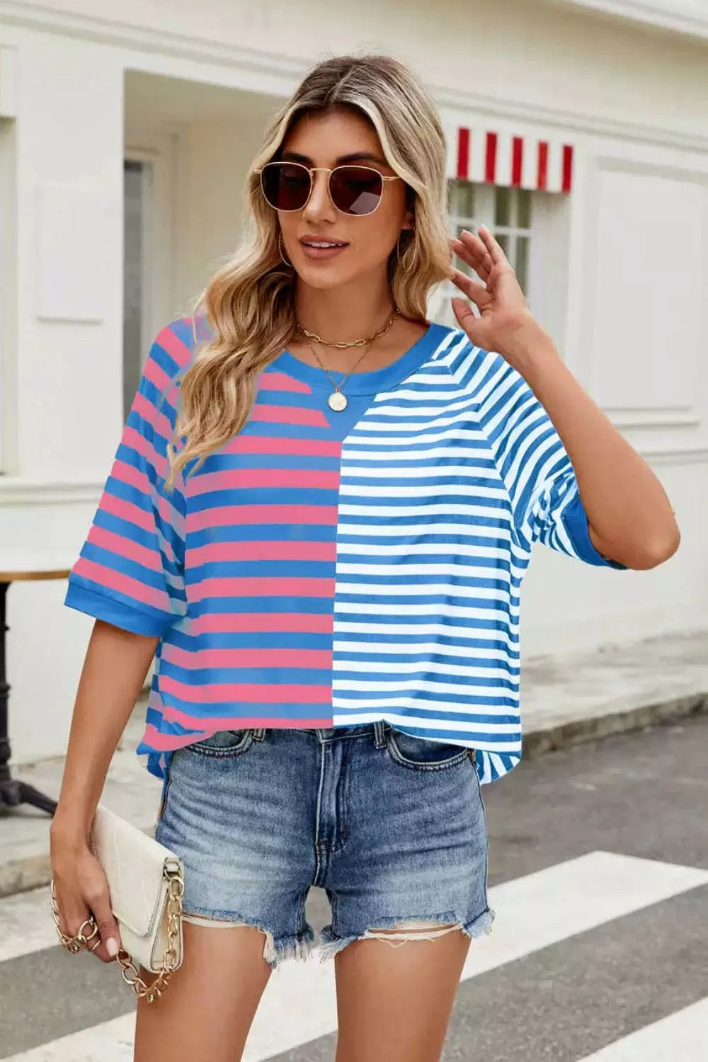 Striped round neck half sleeve T-shirt from Trendsi, featuring a casual top with bold stripe pattern and comfortable fit.