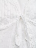 Lace trim tie-front sleeveless tank top from Plush Fashion Hub featuring a stylish, lightweight design with a feminine lace detail.