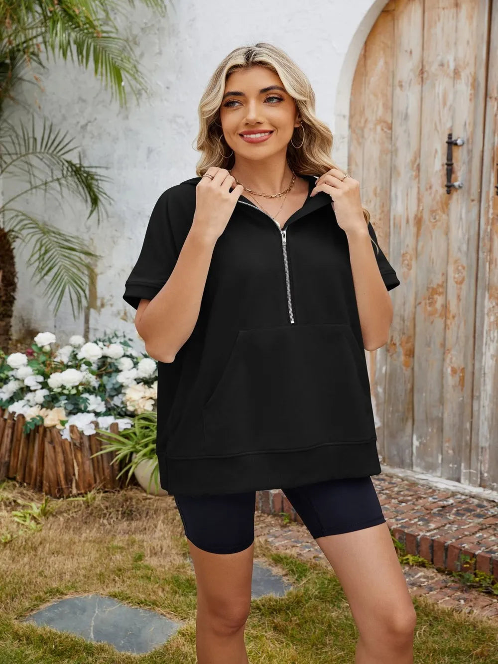 Gray half zip short sleeve hooded top from Trendsi, casual top with a front zipper and hood, perfect for layered outfits.