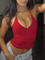 Women's halter neck slim fit cami top by Trendsi, sleeveless stretch tank with a fitted silhouette and stylish design.