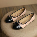 Women's FitiqueFit classic egg-roll edge slip-on flats with round toe design, inspired by Chanel-inspired footwear, on a neutral background.