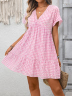 Plush Fashion Hub plaid V-neck mini dress with ruffle hem, lightweight seasonal fashion, featuring a chic plaid pattern and stylish fit.