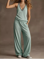 Plus size V-neck tank top and wide-leg pants set by Trendsi, shown in a full view with the matching coordinated outfit.