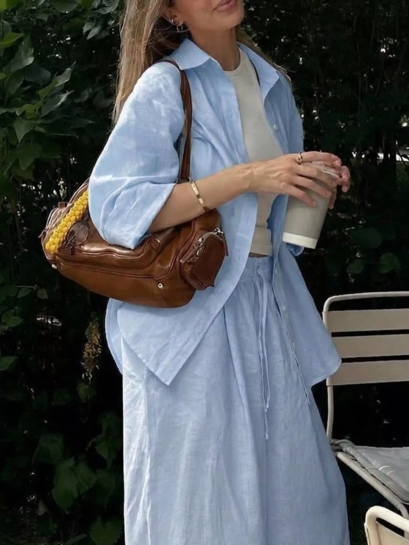 Trendsi loungewear set with button-up shirt and drawstring pants, featuring comfortable casual fabric in neutral tones.