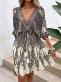 Paisley print batwing sleeve tassel tie front ruffle hem dress by FitiqueFit, casualwear featuring flowy sleeves and a boho-inspired design.