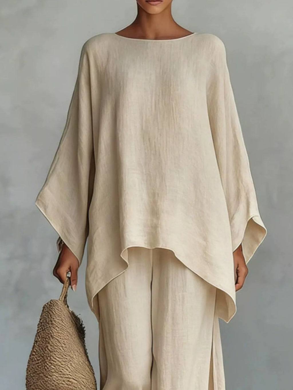 Plus size full size round neck top and wide leg pants set by Trendsi, featuring a comfortable fit and stylish design.