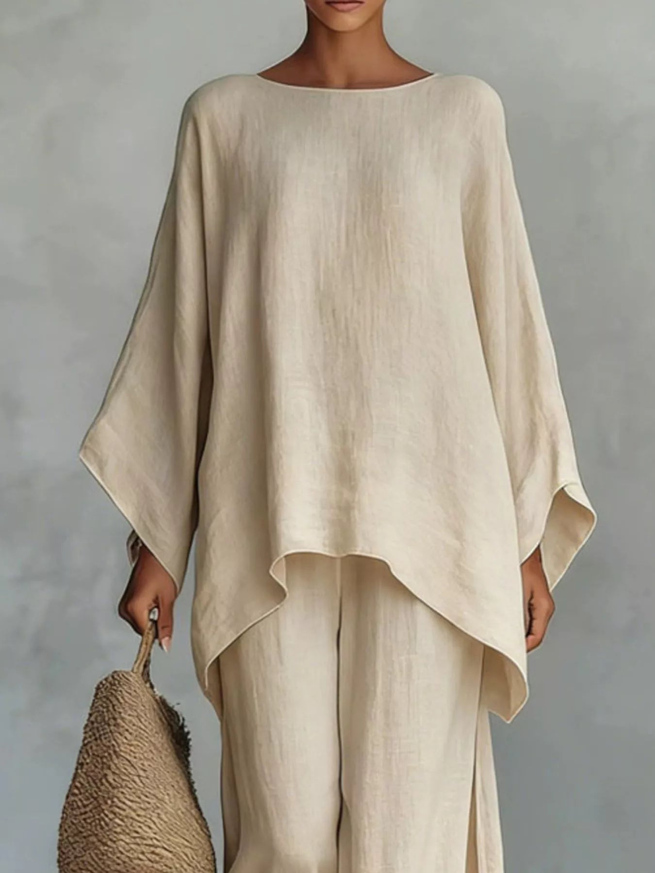 Plus size full size round neck top and wide leg pants set by Trendsi, featuring a comfortable fit and stylish design.