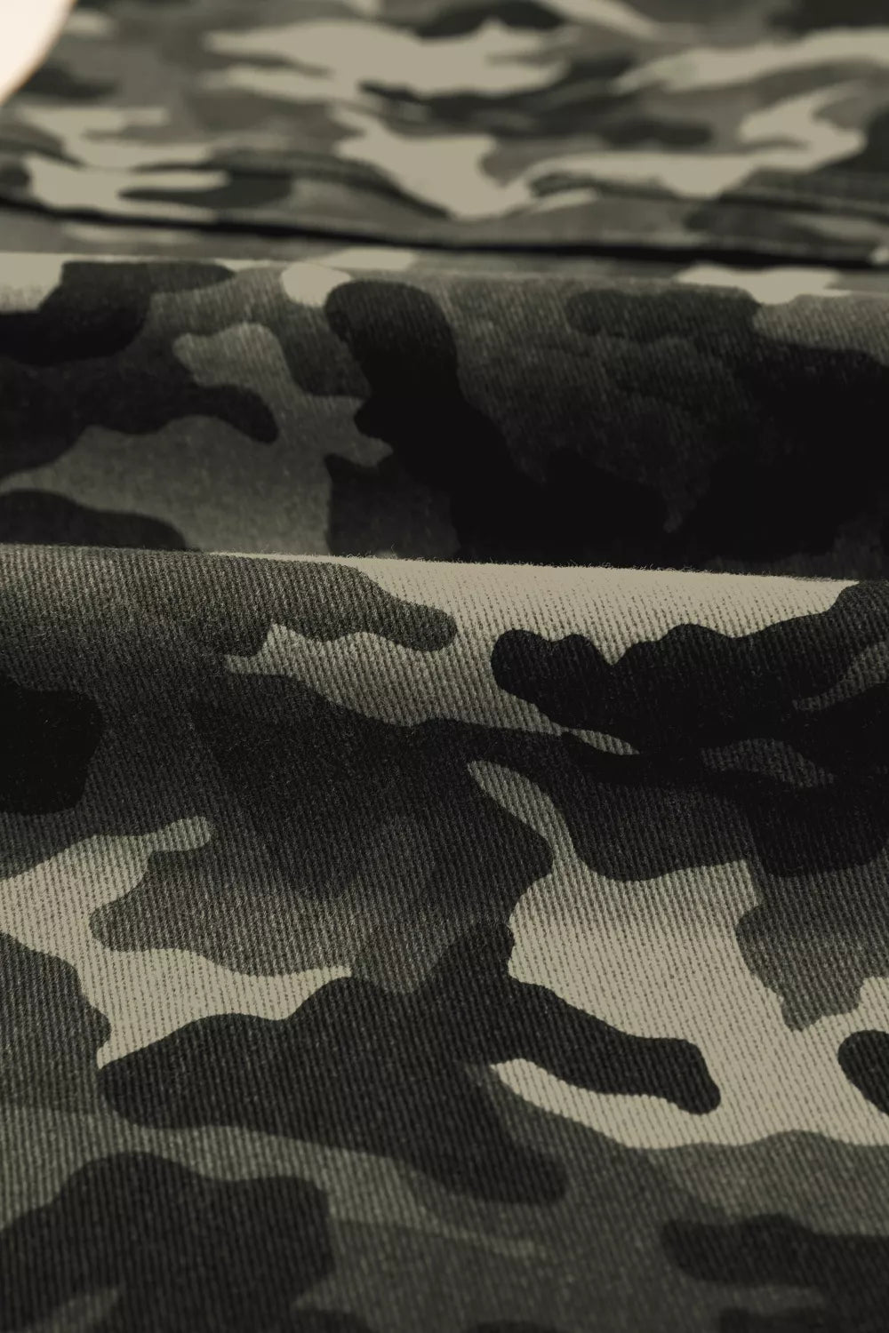 Camouflage print women's denim pants with multiple pockets by Shopimist, featuring a relaxed fit and stylish design.