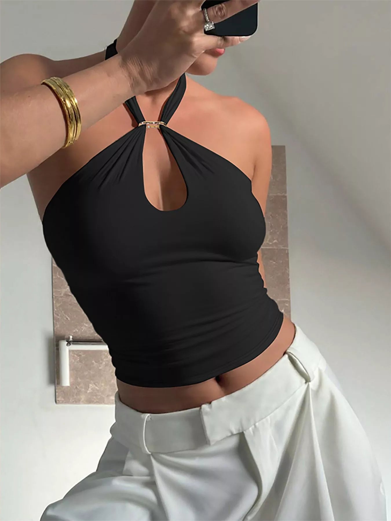 Plush Fashion Hub halter neck cami top with keyhole detail, sleeveless design, and fitted style on a neutral background.