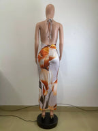 Floral print cowl neck backless maxi dress by Shopimist featuring a flowing silhouette and elegant design.