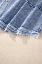 VYSN raw hem button-down long sleeve denim dress displayed on a hanger, showcasing its casual style and distressed hem detail.