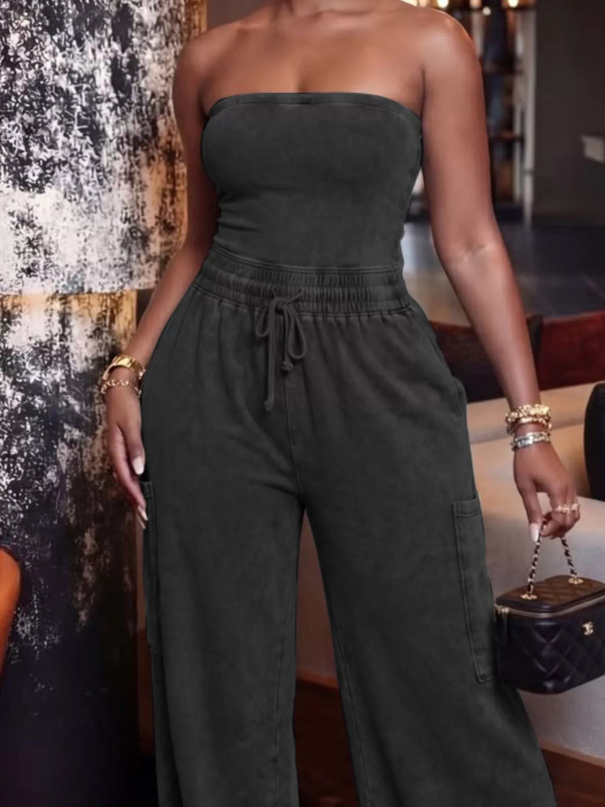 Strapless wide-leg jumpsuit with drawstring waist from Plush Fashion Hub, stylish playsuit perfect for casual or trendy occasions.