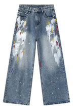 Denim Painting Jeans with pockets by Plush Fashion Shop, featuring a stylish distressed design and functional front and back pockets.