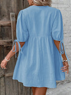 Cotton V-neck tie-front mini dress with puff sleeves, stylish and comfortable, perfect for casual or summer wear.