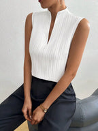 Women's textured notched neck sleeveless tank top by Trendsi, versatile basic shell, shown in a close-up of the top's fabric and design.