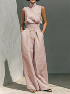 Sleeveless turtleneck top and wide-leg pants set by Trendsi, stylish and comfortable women's fashion ensemble.