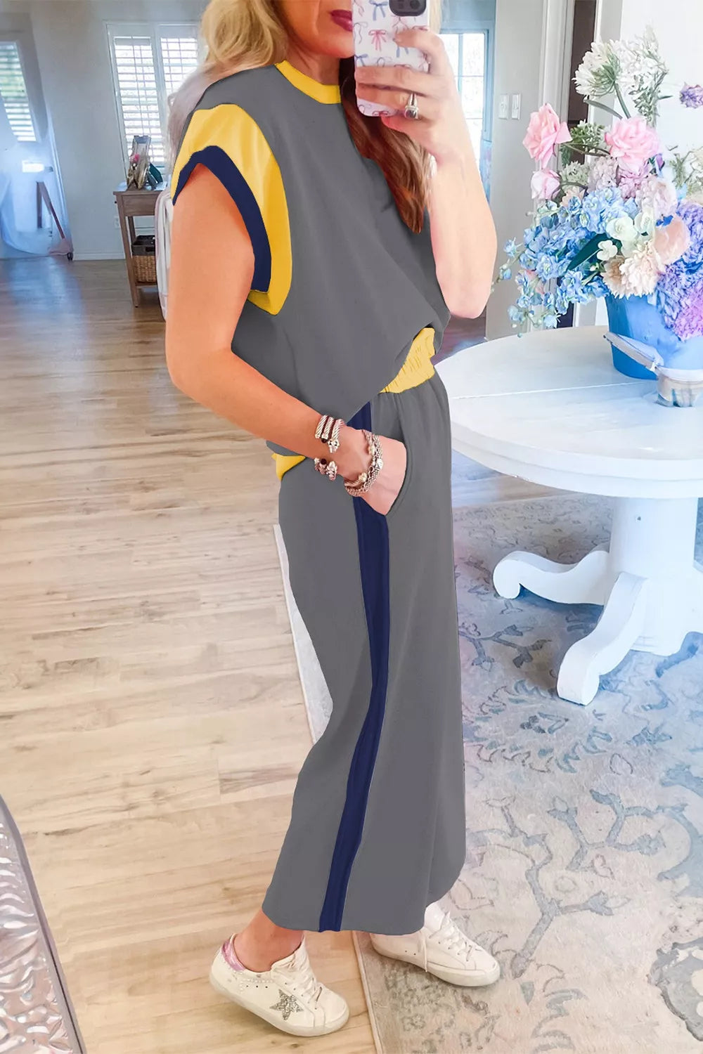 Women's contrast trim lounge set with stylish two-piece top and pants, featuring a comfortable and trendy clothing set from Trendsi.