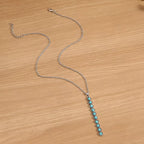 Vintage style beaded bar necklace with colorful beads and gold-tone chain, showcasing a trendy jewelry piece from Shopimist.