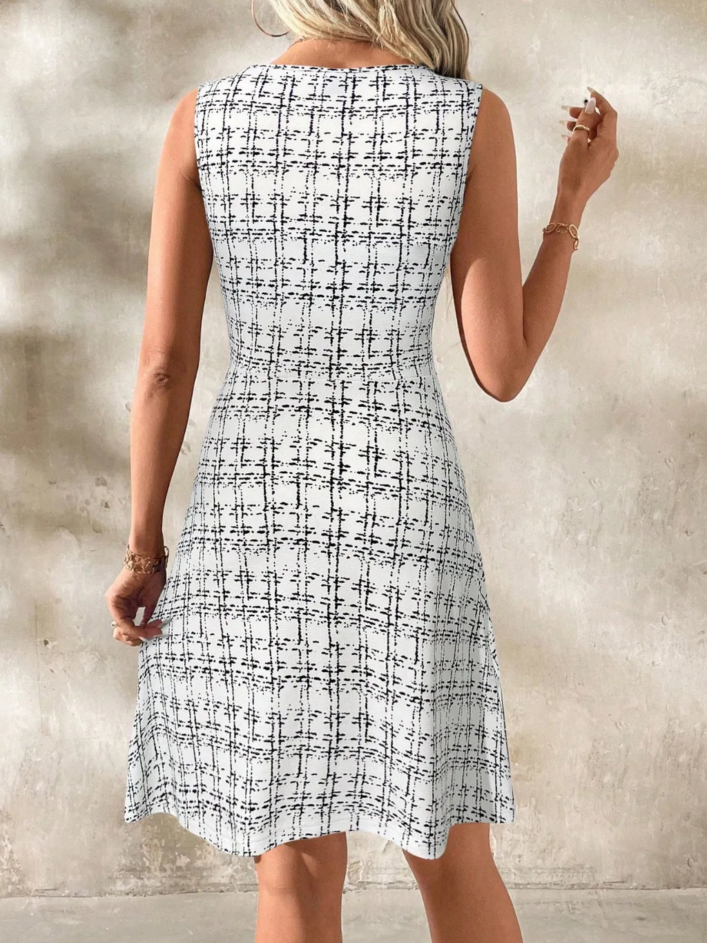 Shopimist round neck sleeveless dress with a flowy fabric and fitted waist, perfect for casual summer wear.