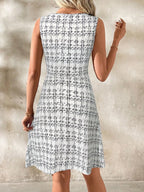 Shopimist round neck sleeveless dress with a flowy fabric and fitted waist, perfect for casual summer wear.