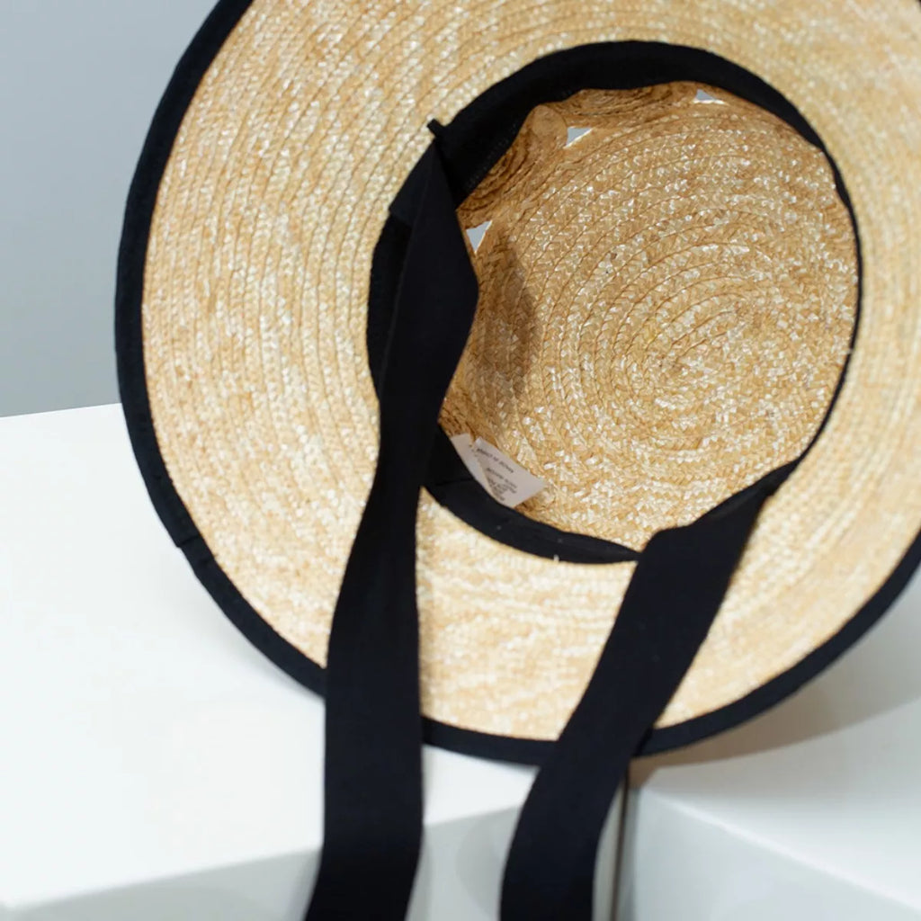 Plush Fashion Hub classic straw sun hat with elegant contrast trim, perfect for summer outdoor wear.