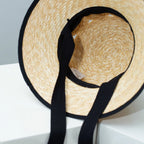 Plush Fashion Hub classic straw sun hat with elegant contrast trim, perfect for summer outdoor wear.