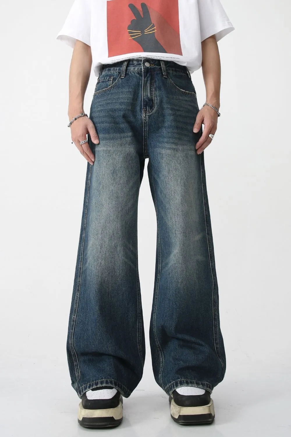 Plush Fashion Shop denim bootcut jeans with front and back pockets, showcasing classic blue denim with a relaxed fit.